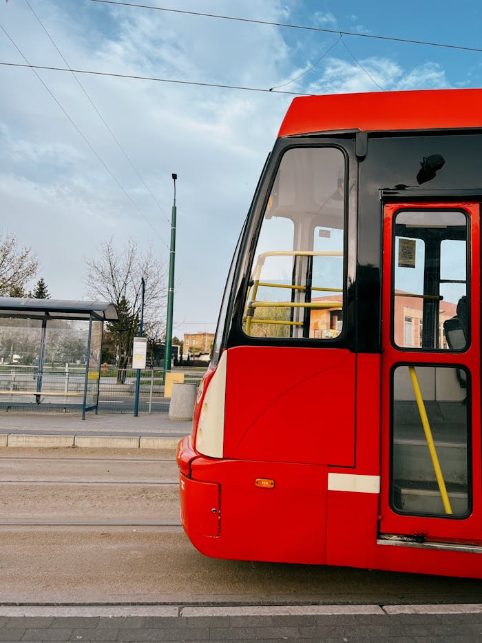 photo 20954741 Vibrant red tram at a station stop in Sosnowiec, showcasing public transportation in Poland.